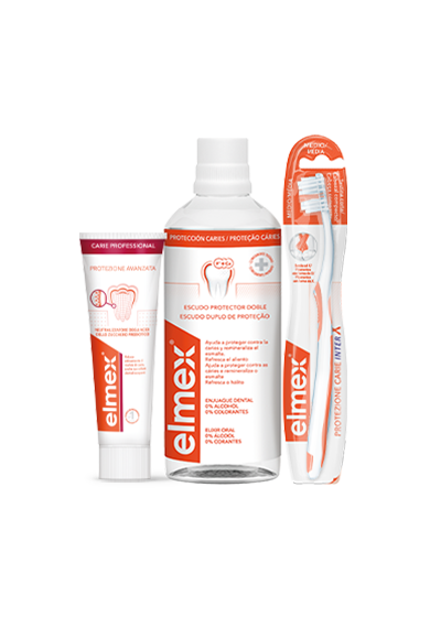 Conjunto de produtos de higiene oral elmex, composto por uma pasta dentífrica, um elixir bucal e uma escova de dentes, sobre fundo laranja